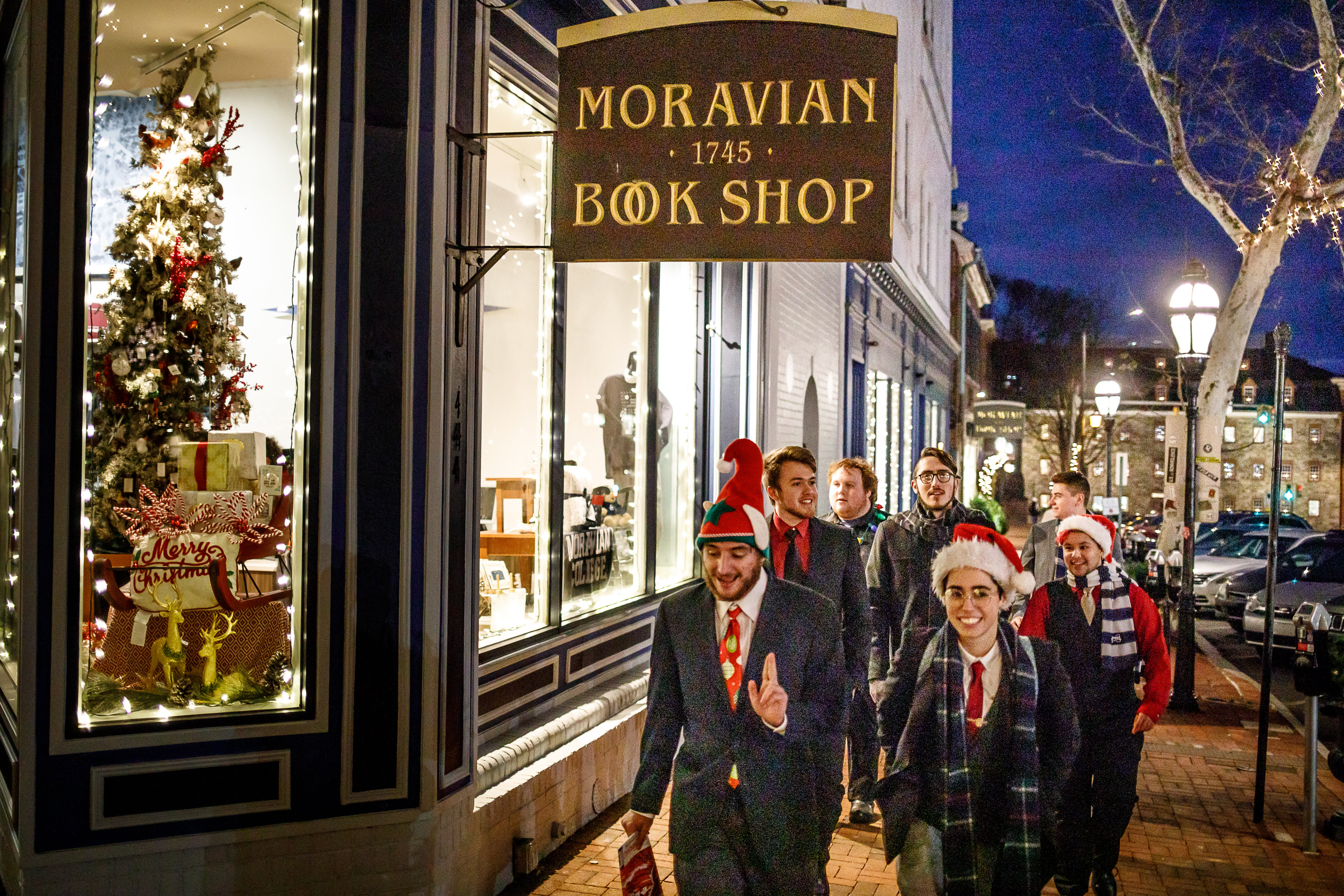 Students walk past the Moravian Book Shop