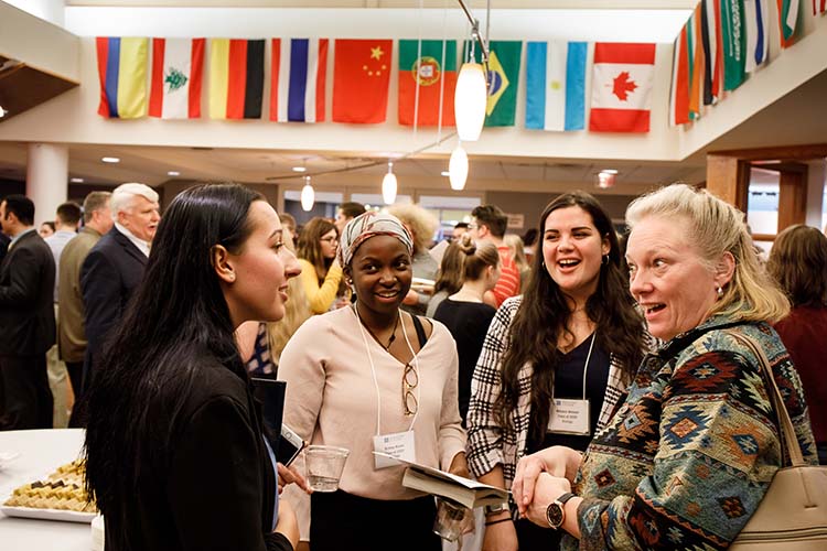 Students network with alumni in the HUB Pavilion. 