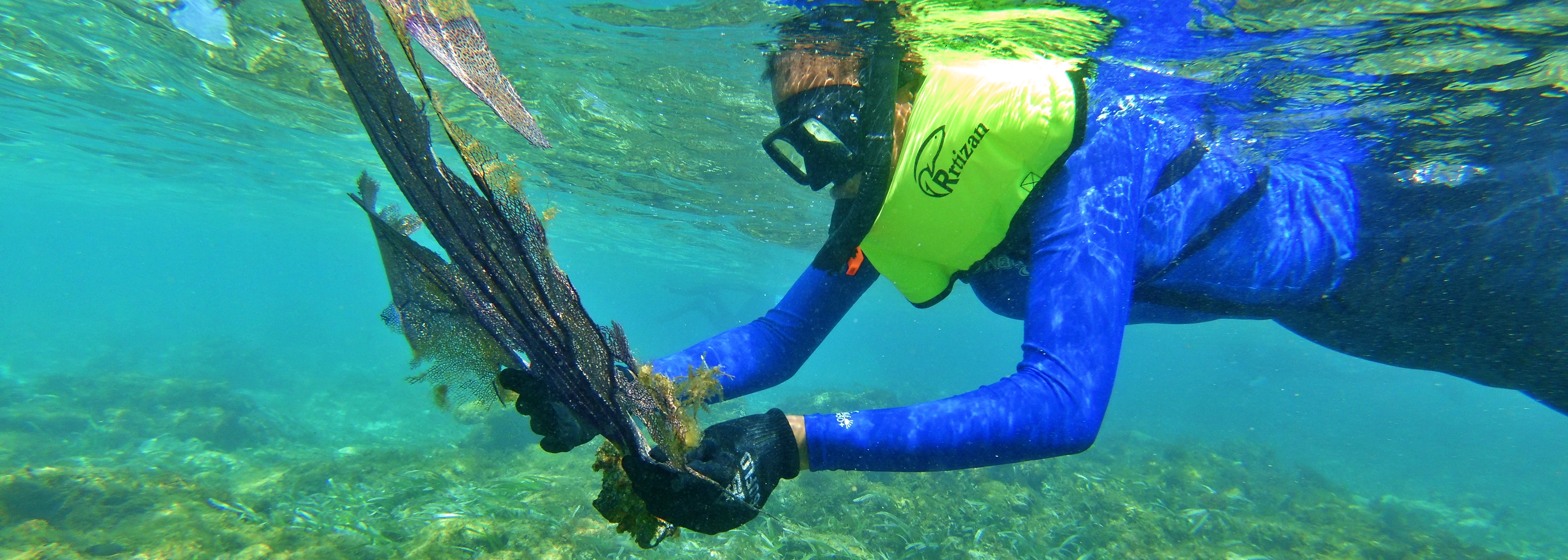 Snorkeling Student with Sea Fan