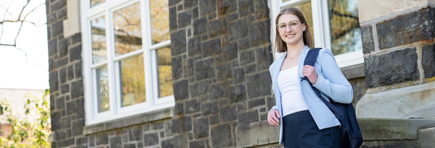 Grad student standing by comenius