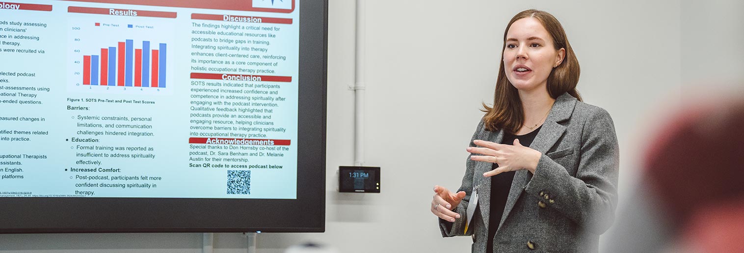 Student presenting at research symposium