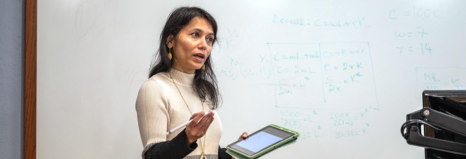 Sonia Aziz at white board