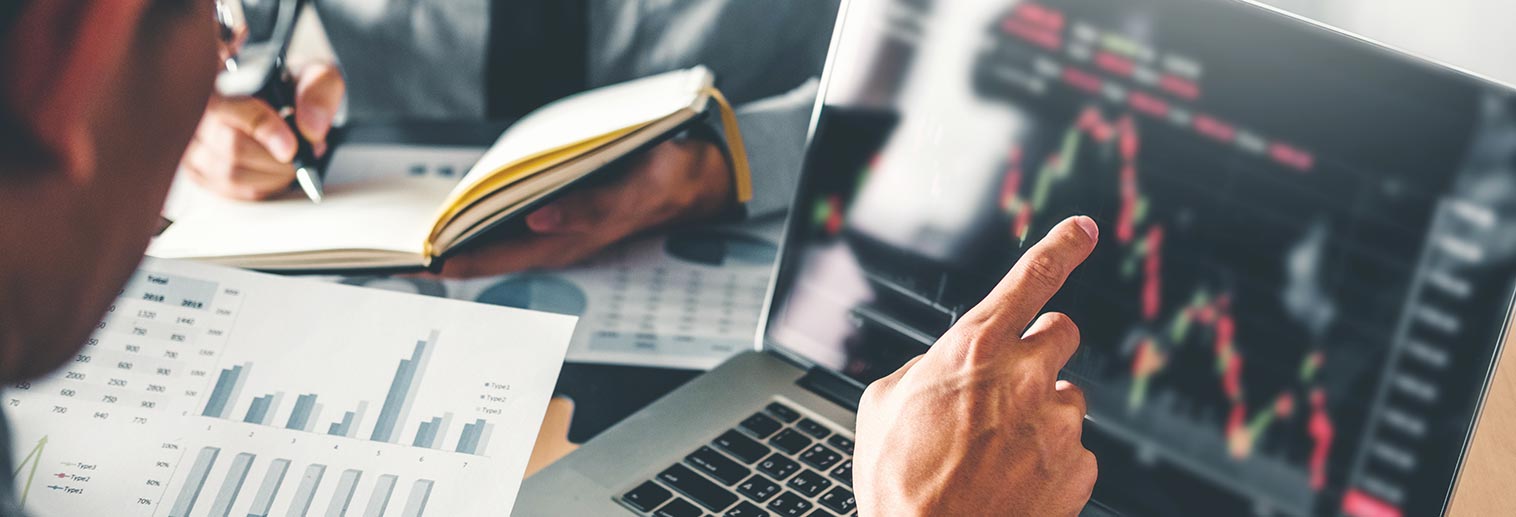 Stock traders reading market report