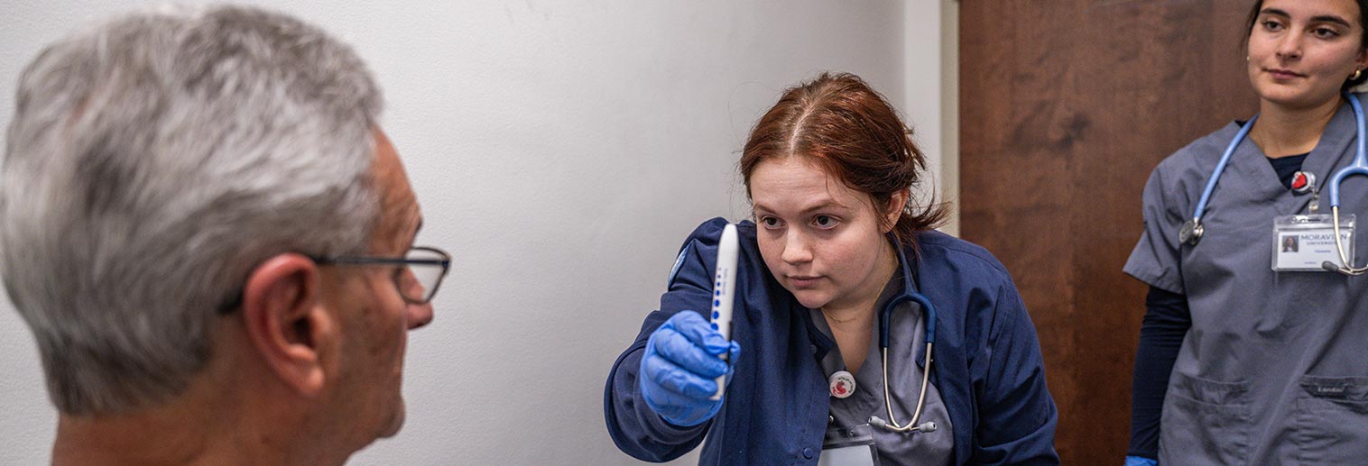 Student working with patient