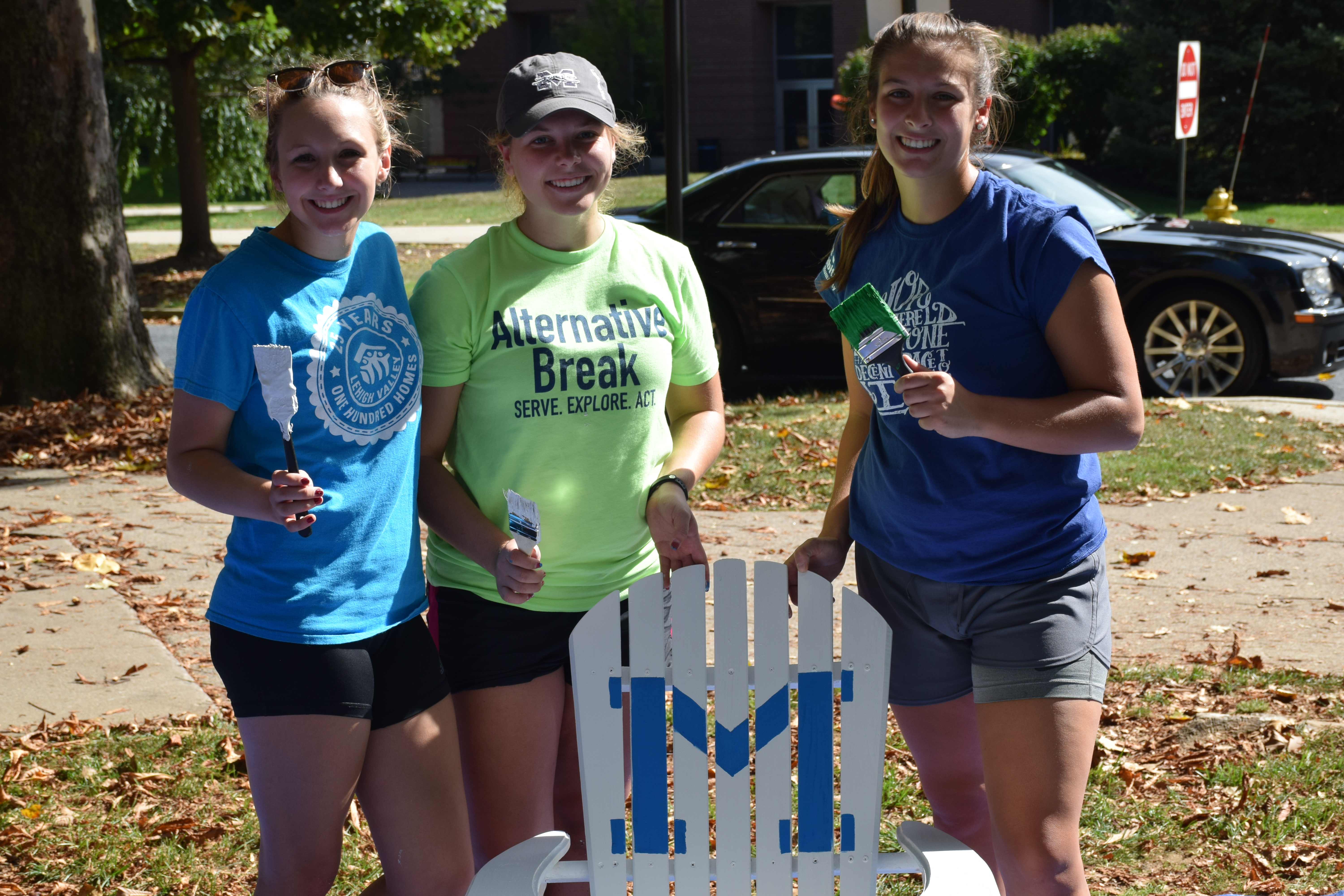 Students volunteer to paint chairs