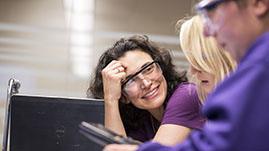 Photo of Shari Dunham working on a problem with a student