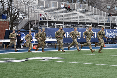 Student veterans participate in football game