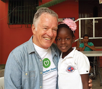 Charlie Decker with a child at the orphanage Hogar Esperanza