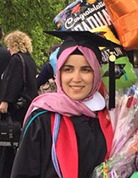 Fatima Susan Tufan '16 posing at graduation.
