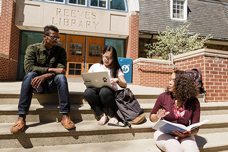 Students sitting on Reeves Library steps