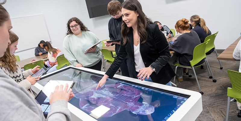 Moravian students learn in the Flicker Virtual Anatomy and Dissection Lab at the Anatomage table to view human anatomy.