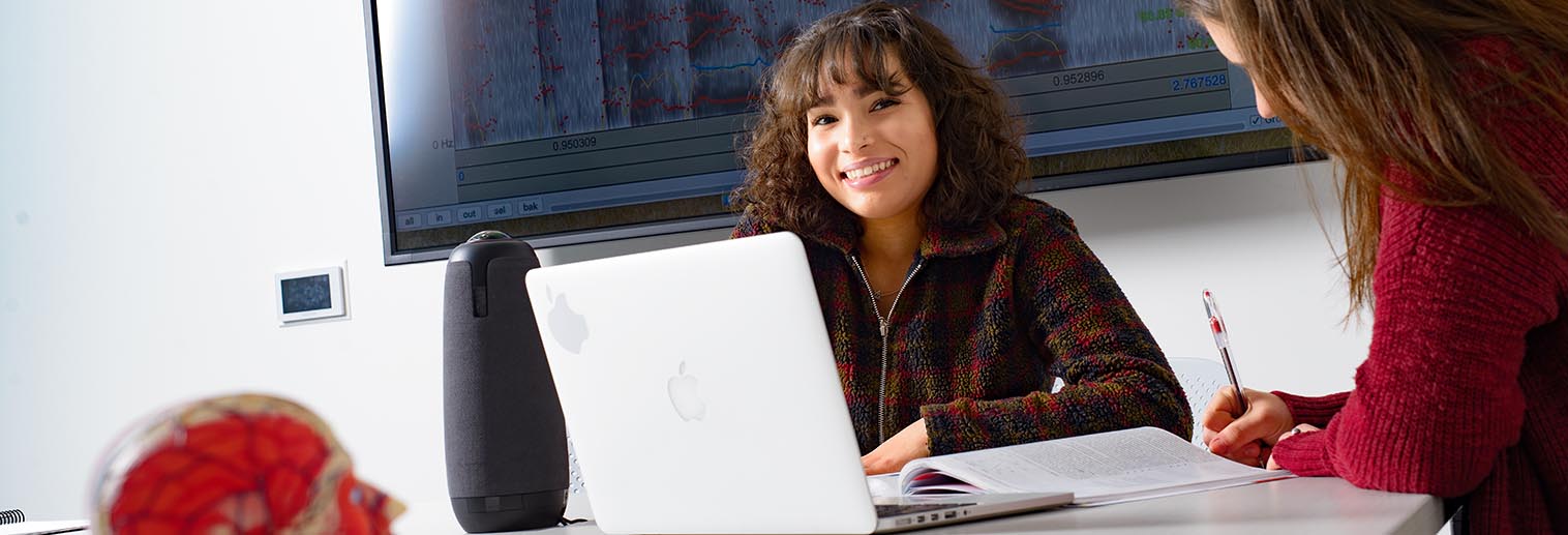 Student on laptop in classroom