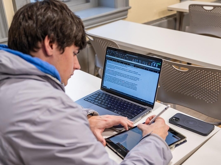 Student in accounting class with laptop
