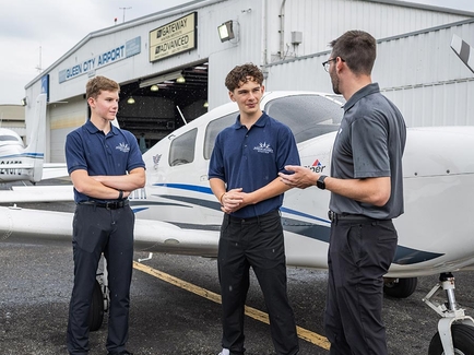 Professor with student outside hangar