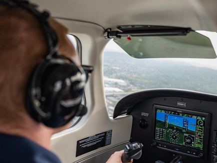 Student piloting airplane