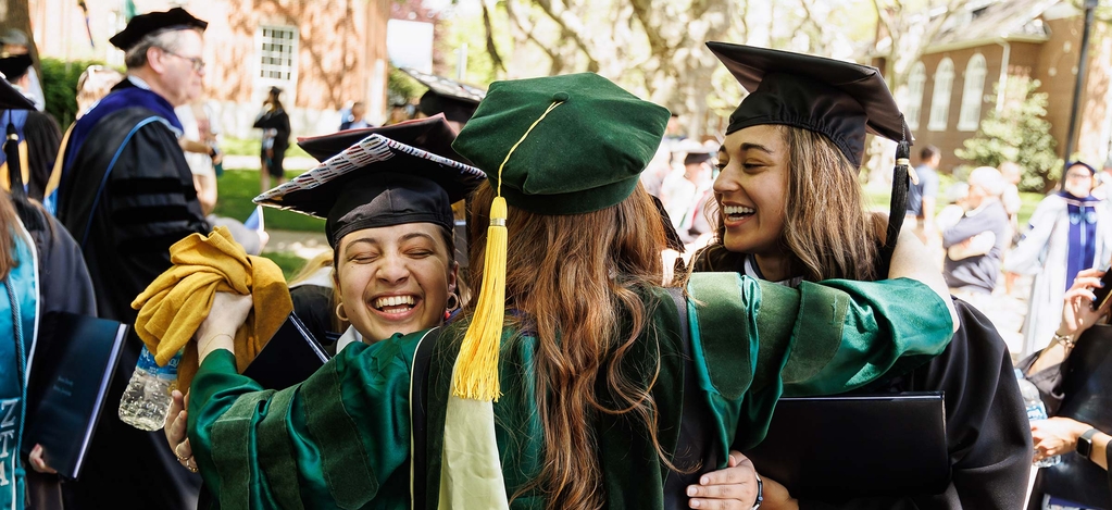 Students hugging at graduation