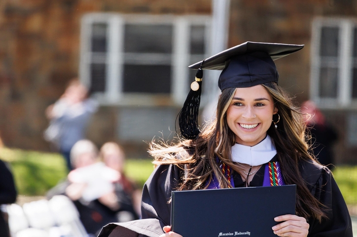 Graduate with degree