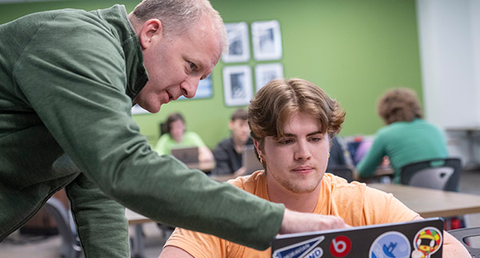 Student and professor in clas