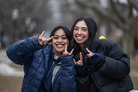 Students making hound sign