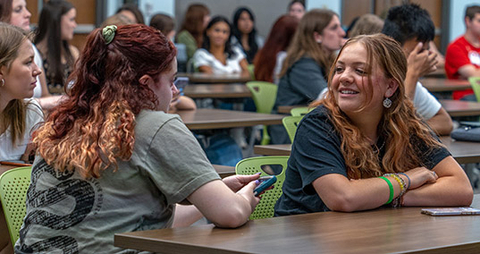 Students chatting at event