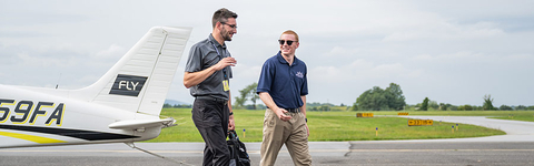 Aviation student and professor by plane