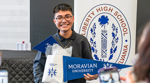Student with Moravian swag