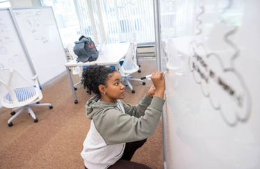Student at white board