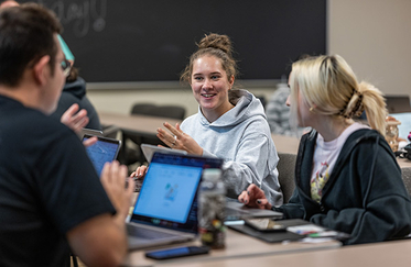 Student in class using laptops