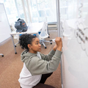 Student at white board