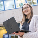 Student in front of library