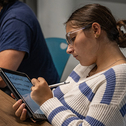 Student in class with iPad